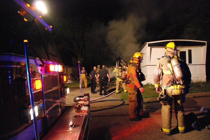 A trailer in Kalamazoo is fully engulfed in flames - a passing motorist helped everyone escape unharmed. Photos by Sean Patrick Duross.
