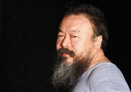 Dissident Chinese artist Ai Weiwei stands in the entrance of his studio after being released on bail in Beijing Dissident Chinese artist Ai Weiwei stands in the entrance of his studio after being released on bail in Beijing
