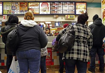 People line up to buy food at a fast food restaurant in Harlem in New York People line up to buy food at a fast food restaurant in Harlem in New York