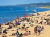 Beachgoers on the shores of Lake Michigan in Saugatuck, Michigan.
