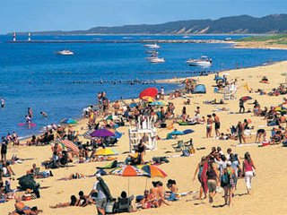 Beachgoers on the shores of Lake Michigan in Saugatuck, Michigan.