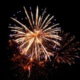 Fireworks explosions litter the sky. 