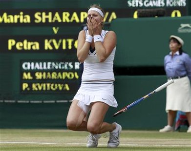 Petra Kvitova of the Czech Republic celebrates after defeating Maria Sharapova of Russia in their final match at the Wimbledon tennis champi Petra Kvitova of the Czech Republic celebrates after defeating Maria Sharapova of Russia in their final match at the Wimbledon tennis champi