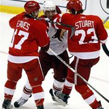 Phoenix Coyotes center Lombardi gets caught between Detroit Red Wings rightwing Eaves and defensman Stuart during their Western Conference q Phoenix Coyotes center Lombardi gets caught between Detroit Red Wings rightwing Eaves and defensman Stuart during their Western Conference q