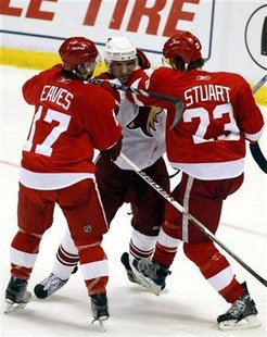 Phoenix Coyotes center Lombardi gets caught between Detroit Red Wings rightwing Eaves and defensman Stuart during their Western Conference q Phoenix Coyotes center Lombardi gets caught between Detroit Red Wings rightwing Eaves and defensman Stuart during their Western Conference q