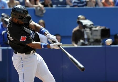 Blue Jays batter Encarnacion hits a two-run home run against the Phillies during the eighth inning of their MLB interleague baseball game in Blue Jays batter Encarnacion hits a two-run home run against the Phillies during the eighth inning of their MLB interleague baseball game in