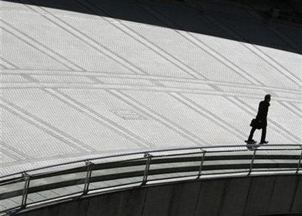 A businessman walks in Tokyo A businessman walks in Tokyo