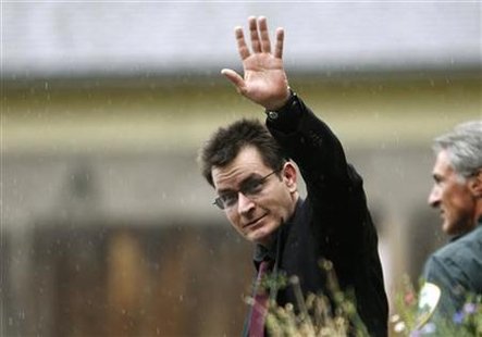 Actor Charlie Sheen gestures towards the media as he leaves the Pitkin County Courthouse after a sentencing hearing in Aspen Actor Charlie Sheen gestures towards the media as he leaves the Pitkin County Courthouse after a sentencing hearing in Aspen