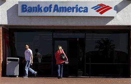 Customers are seen outside of a Bank of America in Tucson Customers are seen outside of a Bank of America in Tucson