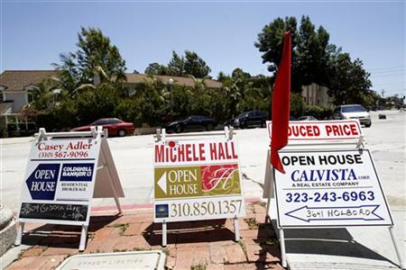 Signs advertising open houses for real estate sale are seen in Los Angeles Signs advertising open houses for real estate sale are seen in Los Angeles