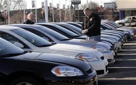 Car salesman Ray Schaffer shows a customer a 2009 Chevrolet Impala sedan at a dealership in Dearborn, Michigan Car salesman Ray Schaffer shows a customer a 2009 Chevrolet Impala sedan at a dealership in Dearborn, Michigan