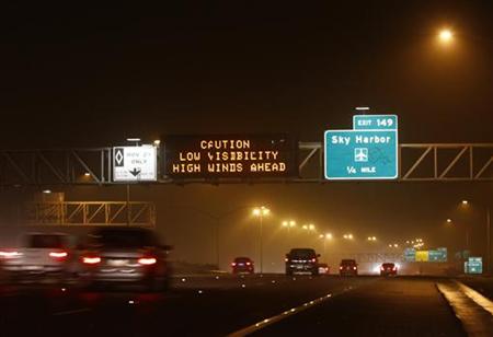 Motorists drive along Interstate-10 during a dust storm in Phoenix Motorists drive along Interstate-10 during a dust storm in Phoenix