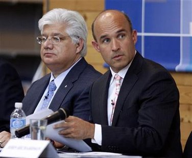 Research in Motion co-CEO Jim Balsillie and President and co-CEO Mike Lazaridis listen during the annual general meeting of shareholders in Research in Motion co-CEO Jim Balsillie and President and co-CEO Mike Lazaridis listen during the annual general meeting of shareholders in