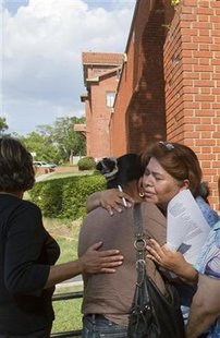 Relatives of Mexican national Humberto Leal Garcia comfort each other while awaiting his execution outside the Walls prison unit in Huntsvil Relatives of Mexican national Humberto Leal Garcia comfort each other while awaiting his execution outside the Walls prison unit in Huntsvil