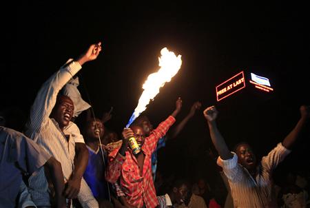 People take part in South Sudan's independence day celebrations near the countdown clock in Juba People take part in South Sudan's independence day celebrations near the countdown clock in Juba