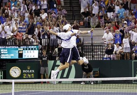Mike Bryan and Bob Bryan, of the U.S., celebrate after defeating Fernando Verdasco and Marcel Granollers of Spain during their Davis Cup dou Mike Bryan and Bob Bryan, of the U.S., celebrate after defeating Fernando Verdasco and Marcel Granollers of Spain during their Davis Cup dou