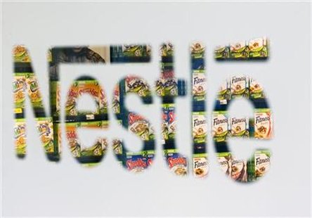 Nestle cereal boxes are pictured through a logo in the company supermarket at the Nestle headquarters in Vevey Nestle cereal boxes are pictured through a logo in the company supermarket at the Nestle headquarters in Vevey