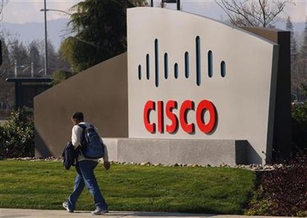 A pedestrian walks past the Cisco logo at the technology company's campus in San Jose A pedestrian walks past the Cisco logo at the technology company's campus in San Jose