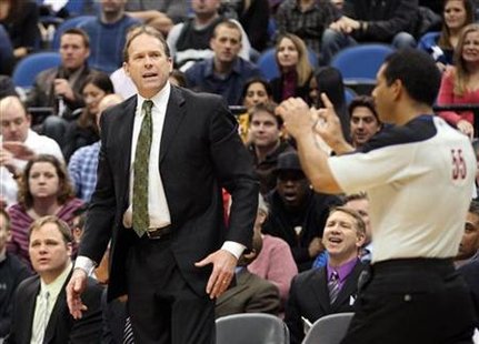 Minnesota Timberwolves head coach Kurt Rambis reacts to foul called in NBA game against Raptors in Minneapolis Minnesota Timberwolves head coach Kurt Rambis reacts to foul called in NBA game against Raptors in Minneapolis