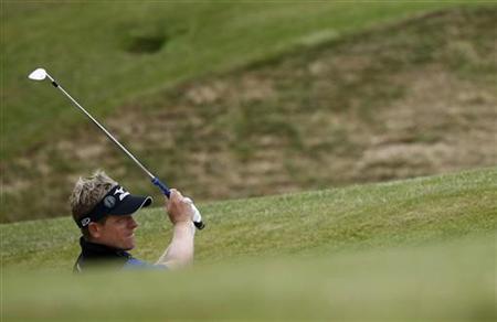 Luke Donald of England plays out of a bunker during a practice round for the British Open golf championship at Royal St George's in Sandwich Luke Donald of England plays out of a bunker during a practice round for the British Open golf championship at Royal St George's in Sandwich