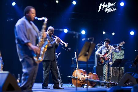U.S. jazz bassist Miller performs onstage with saxophonist Shorter and trumpeter Jones during the tribute to Miles Davis evening at the 45th U.S. jazz bassist Miller performs onstage with saxophonist Shorter and trumpeter Jones during the tribute to Miles Davis evening at the 45th