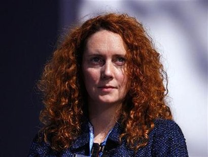 File photo of Chief Executive of News International, Brooks, listening to speeches during the Conservative Party conference in Manchester
