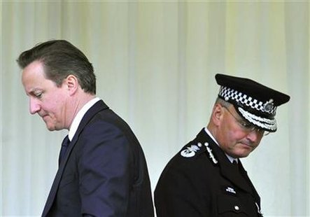 Britain's Prime Minister David Cameron and Metropolitan Police Commissioner Paul Stephenson attend a memorial ceremony for police officer Ga Britain's Prime Minister David Cameron and Metropolitan Police Commissioner Paul Stephenson attend a memorial ceremony for police officer Ga