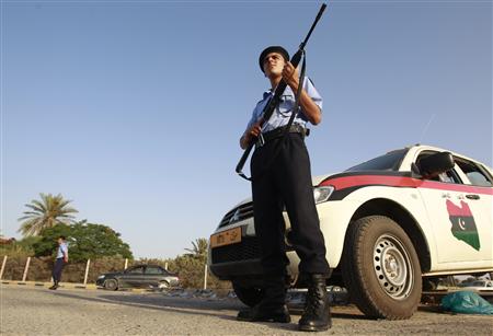 Libyan national security officers stand guard at a street in the rebel-held city of Misrata Libyan national security officers stand guard at a street in the rebel-held city of Misrata