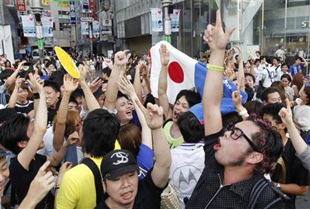 Japan soccer fans celebrate on