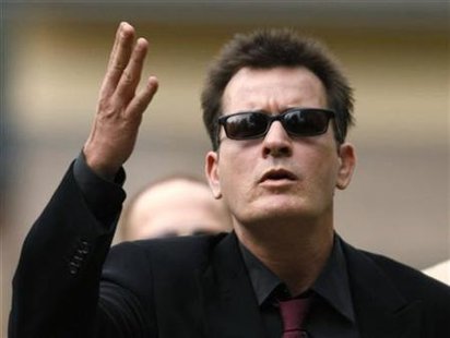 Charlie Sheen gestures towards fans as he arrives for a sentencing hearing at the Pitkin County Courthouse in Aspen Charlie Sheen gestures towards fans as he arrives for a sentencing hearing at the Pitkin County Courthouse in Aspen