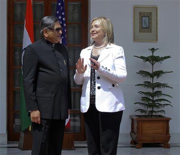 Secretary of State Clinton speaks with India's Foreign Minister Krishna during a photo call before their meeting in New Delhi Secretary of State Clinton speaks with India's Foreign Minister Krishna during a photo call before their meeting in New Delhi