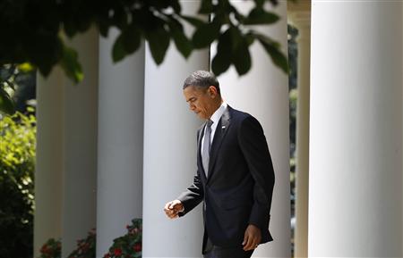 President Barack Obama walks at the White House in Washington President Barack Obama walks at the White House in Washington