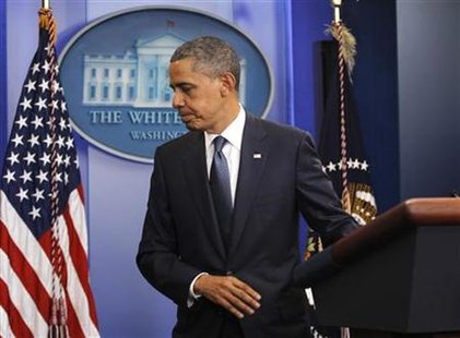 President Barack Obama walks from the podium after making a statement to the press on debt reduction in the Brady Press briefing room of the President Barack Obama walks from the podium after making a statement to the press on debt reduction in the Brady Press briefing room of the