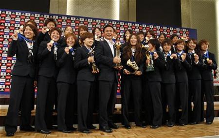 Japan's women's world cup soccer team head coach Sasaki and players pose during a photo session after a news conference in Tokyo Japan's women's world cup soccer team head coach Sasaki and players pose during a photo session after a news conference in Tokyo