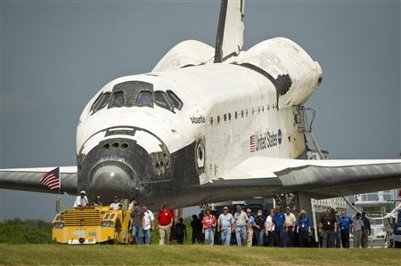 Space shuttle Atlantis (STS-135) is rolled over to the Obiter Processing Facility (OPF) shortly after landing at NASA's Kennedy Space Center Space shuttle Atlantis (STS-135) is rolled over to the Obiter Processing Facility (OPF) shortly after landing at NASA's Kennedy Space Center