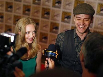 Cast members Timberlake and Seyfried speak during an interview for their upcoming motion picture "In Time" at Comic Con in San Diego Cast members Timberlake and Seyfried speak during an interview for their upcoming motion picture "In Time" at Comic Con in San Diego
