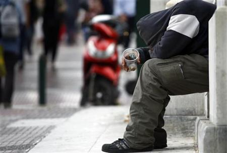 A beggar is seen on a street in central Athens A beggar is seen on a street in central Athens