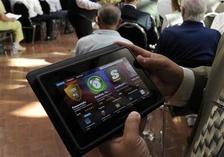 A man holds a BlackBerry PlayBook during the RIM annual general meeting of shareholders in Waterloo A man holds a BlackBerry PlayBook during the RIM annual general meeting of shareholders in Waterloo