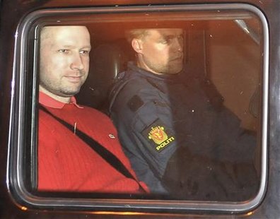 Norwegian Breivik, man accused of a killing spree and bomb attack in Norway, sits in the rear of a vehicle as he is transported in a police Norwegian Breivik, man accused of a killing spree and bomb attack in Norway, sits in the rear of a vehicle as he is transported in a police