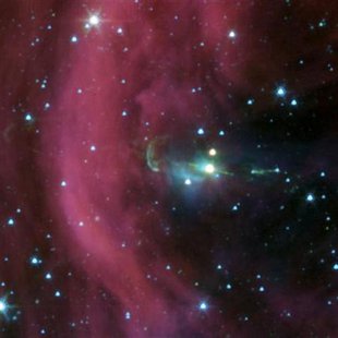 A baby star sprouts two identical jets, seen as green lines emanating from a fuzzy star, in this photograph taken by the Spitzer Space Teles A baby star sprouts two identical jets, seen as green lines emanating from a fuzzy star, in this photograph taken by the Spitzer Space Teles