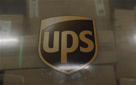 The emblem of of United Parcel Service is seen at the cargo center at the Cologne/Bonn airport near Cologne The emblem of of United Parcel Service is seen at the cargo center at the Cologne/Bonn airport near Cologne
