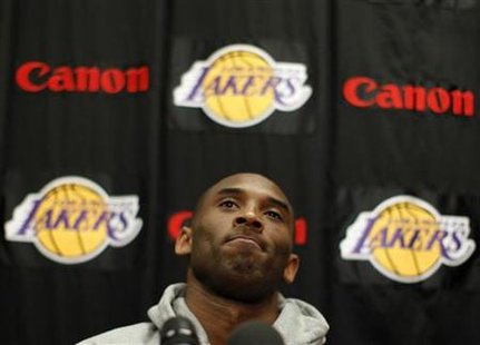 Lakers' Bryant reacts during a news conference in Los Angeles Lakers' Bryant reacts during a news conference in Los Angeles