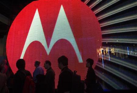 People pass by the Motorola booth during the 2011 International Consumer Electronics Show (CES) in Las Vegas People pass by the Motorola booth during the 2011 International Consumer Electronics Show (CES) in Las Vegas