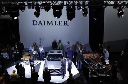 People look at historic and future Daimler cars at a Daimler annual shareholder meeting in Berlin People look at historic and future Daimler cars at a Daimler annual shareholder meeting in Berlin
