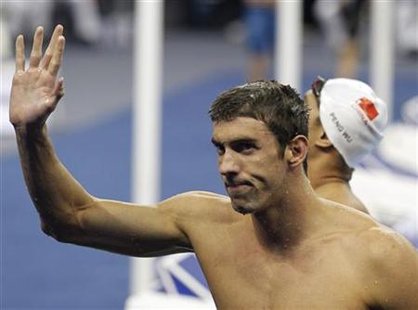 Phelps of the U.S. waves after winning the men's 200m butterfly final at the 14th FINA World Championships in Shanghai Phelps of the U.S. waves after winning the men's 200m butterfly final at the 14th FINA World Championships in Shanghai