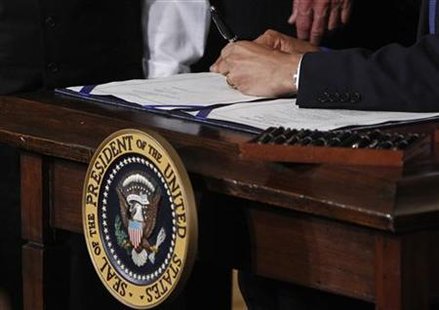 President Barack Obama signs the health insurance reform bill in the East Room at the White House in Washington President Barack Obama signs the health insurance reform bill in the East Room at the White House in Washington