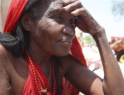 An internally displaced Somali woman sits outside her shelter at a camp in capital Mogadishu An internally displaced Somali woman sits outside her shelter at a camp in capital Mogadishu