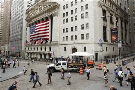 Pedestrians walk past the outside of the New York Stock Exchange in New York Pedestrians walk past the outside of the New York Stock Exchange in New York