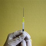 A nurse prepares a flu vaccine shot A nurse prepares a flu vaccine shot