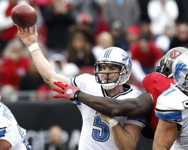 Detroit Lions quarterback Drew Stanton (5) gets a pass away for a first down in overtime against the Tampa Bay Buccaneers during their NFL football game in Tampa, Florida December 19, 2010. REUTERS